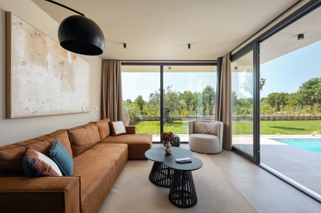Modern living room with pool view in luxury villa Casa Tia I in Istria