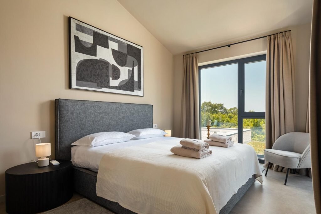 Modern bedroom in luxury villa in Istria with garden view – Casa Tia near Poreč