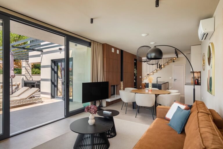 Modern open-plan living and dining area in luxury villa in Istria
