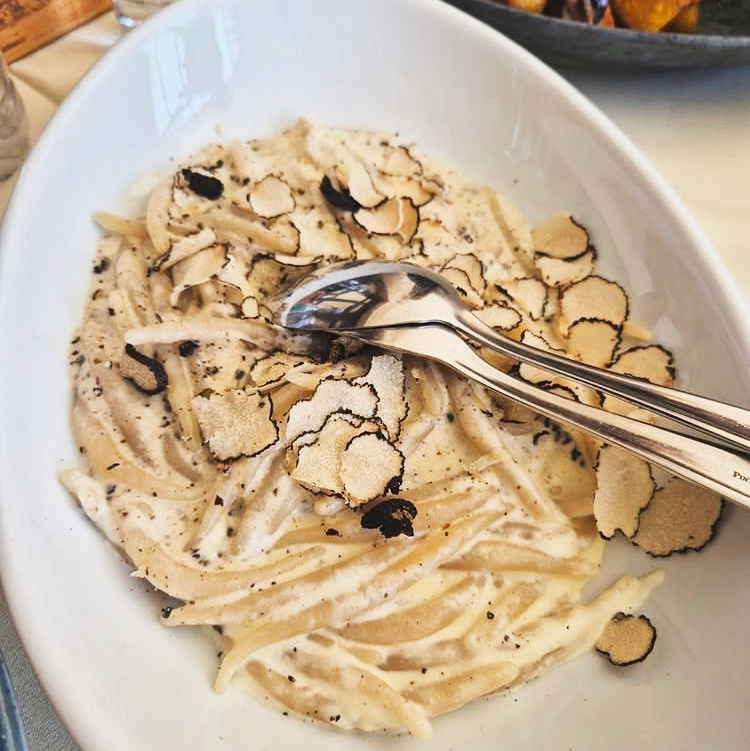 Traditional Istrian pljukanci pasta with fresh truffles, a classic Istrian dish near Poreč