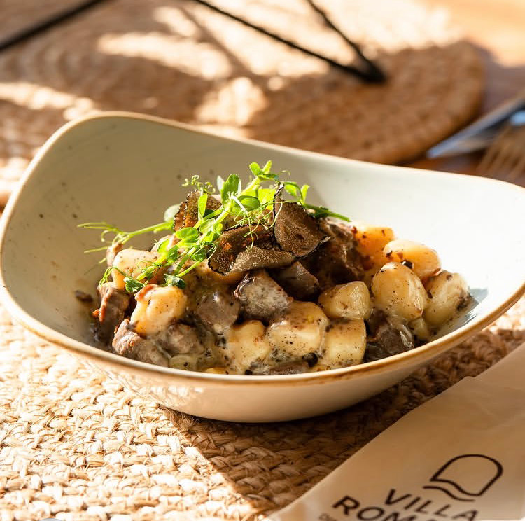 Traditional Istrian gnocchi with meat sauce and truffles, a classic dish served in konobas near Poreč